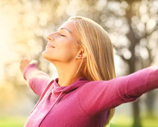 Woman Happy with Sun Hitting her face